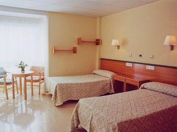 Residencial Torrefuentes dormitorio con 2 camas